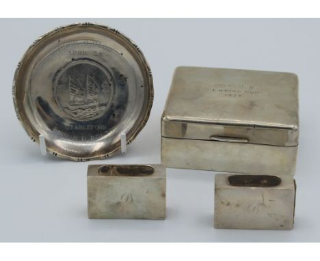 A silver cigarette box, Birmingham 1939, presentation inscription to cover, 4 x 8.5 x 7.5cm, together with two silver matchbo