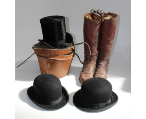 A top hat by Christies of London within a leather case and a pair of calf length leather riding boots and a Moore's bowler ha