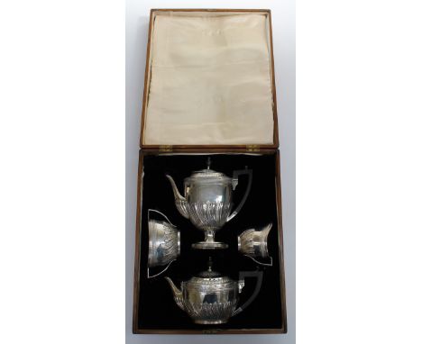 Edward Hutton, a Victorian silver four piece tea and coffee service. Comprising two pots, twin handled sugar and cream, each 