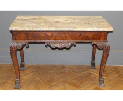 A carved walnut framed console table, the marble top raised on acanthus carved cabriole above a carved frieze, legs and pad f