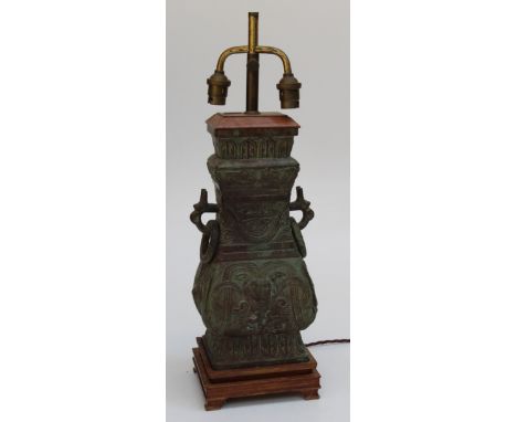 An early 20th century Chinese bronze twin light table lamp/ vase conversation 52cm ( including fittings)