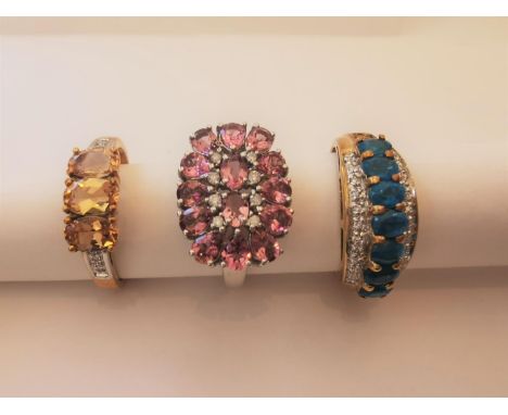 Three 20th century 9 carat white gold gem-set rings: a blue stone and diamond dress ring, diamond and pink stone cluster ring