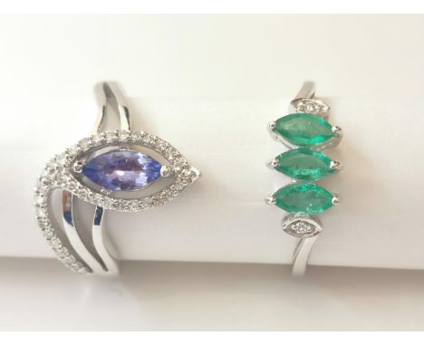 Two 20th century 18 carat white gold gem-set rings: a diamond and tanzanite serpent form dress ring and a three stone emerald