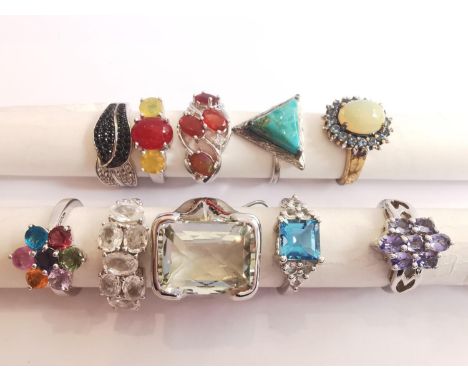 A collection of ten silver and gold plated silver dress rings some set with gemstones, including fire opal, turquoise, amethy