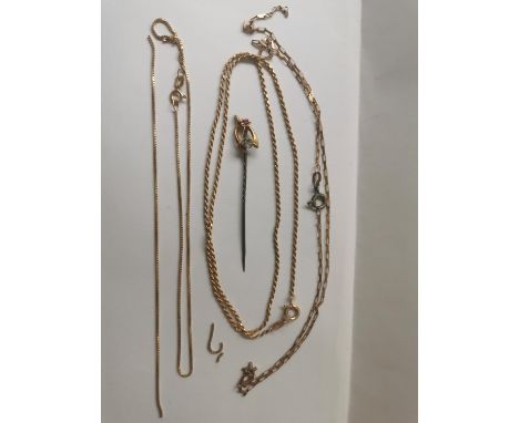 A collection of 9ct yellow gold various link chains and a 14ct gold wishing bone stick pin. (Two chains broken) The stick pin