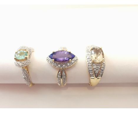 Three 20th century 18 carat yellow gold gem-set rings: a Marquise cluster ring set with Tanzanite and diamond ring, a  diamon