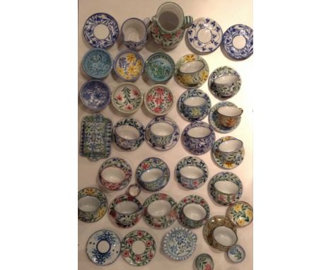 A 20TH CENTURY PORCHES POTTERY, PORTUGUAL COLLECTION OF HAND PAINTED POTTERY ITEMS To include two jugs, seventeen cups and sa