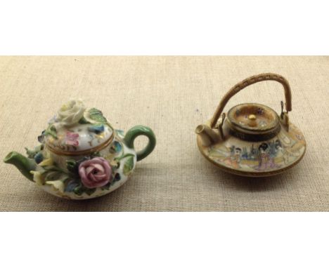 A 19TH CENTURY MEISSEN MINIATURE TEAPOT Encrusted with flowers, along with a Japanese Meiji period satsuma miniature teapot. 
