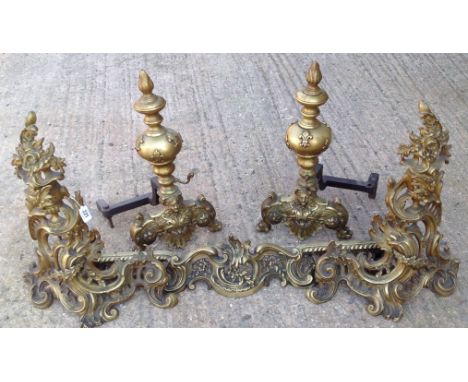 A 19TH CENTURY FRENCH GILT BRONZE CHENET With floral urn finials and cast pierced rails, along with a pair of Regency brass f