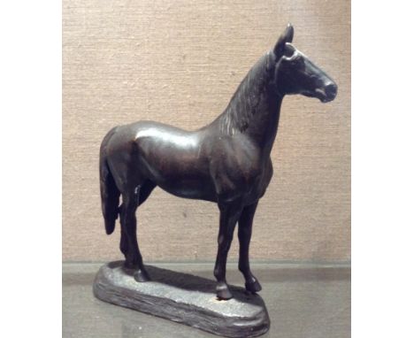 CHAS CURRY An early 20th Century American bronze study of a thoroughbred horse, signed on oval base. (approx 19cm) Condition: