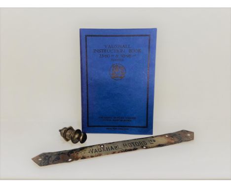 A trio of items of Vauxhall automobiliaEmbossed Royal Blue card covers 44 numbered pages, including the fold-out lubrication 