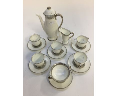 A Royal Doulton platinum trim coffee service, dated 1933, soups and saucers, coffee pot, milk, sugar 