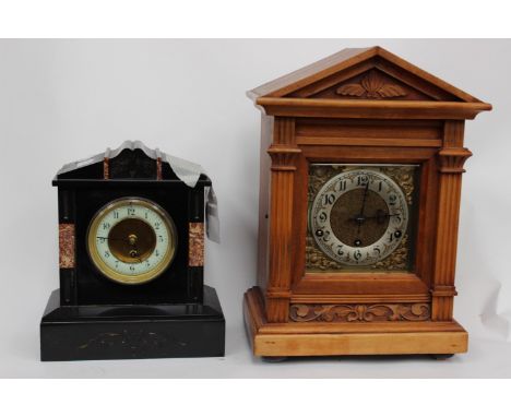 A black slate mantle time piece with Arabic numerals to dial, pendulum and key, together with a wood cased bracket clock with