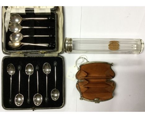 A boxed set of silver spoons with coffee bean finial's by Gladwin Ltd Of Sheffield 1940, a silver topped glass vanity bottle,