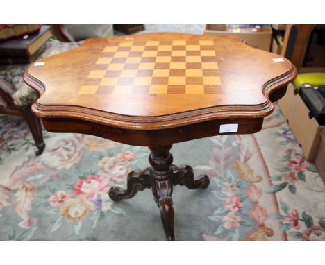 A 20th Century burr elm and chequered top chess table, raised on a pedestal base