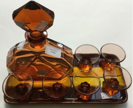 A Continental Art Deco pressed amber glass liqueur set, including faceted decanter and six conical glasses, labelled Von Stre
