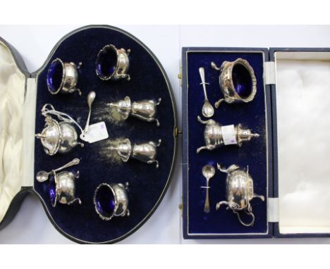An Elizabeth II silver condiment set including mustard, salt and pepper pot, 1957Two cased condiment sets, J B Chatterley & S