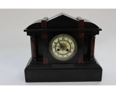 A Victorian black slate and marble mantle clock 