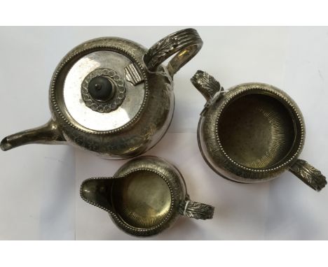 A silver three piece tea service, London hallmarks, chased foliate design, approx gross weight 43.19ozt