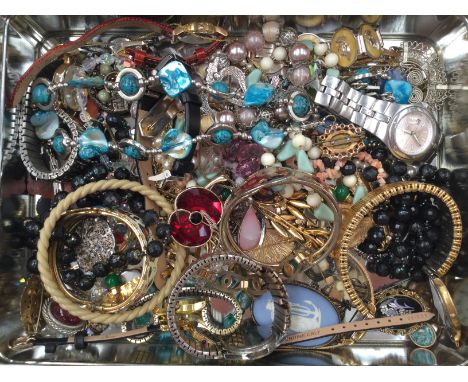 A collection of costume jewellery to include beads, necklaces, sodalite pendant, various 1950s brooches and bangles, together