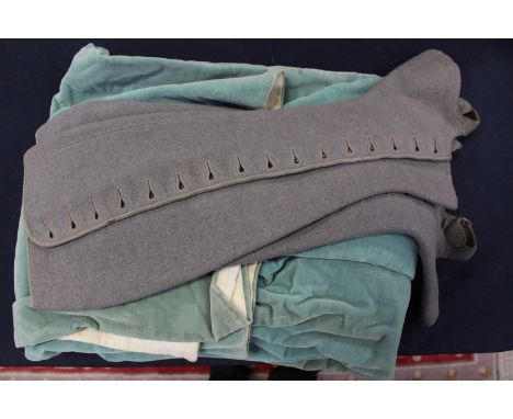 A pair of grey 1920 leggings in felt with buttons and four hook fastenings, stirrup buckles, a child's lovatt green velvet Ed