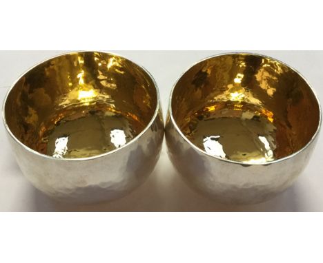A pair of Modernist Britannia silver planished bowls, gilt interiors made by Robert Lamb, .958 Britannia silver, Sheffield 20