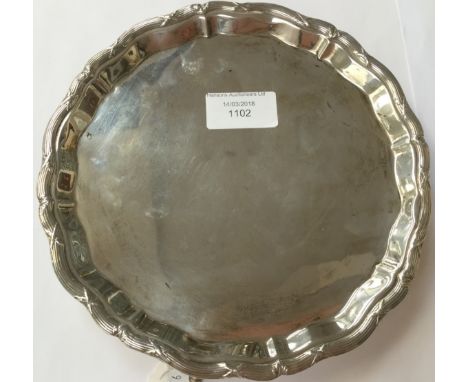 A silver salver, four Lion feet, Sheffield 1906, weighing approx 9.50 ozt 