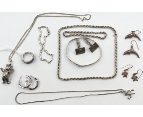 A group of silver jewellery, comprising a rope twist teddy bear on a chain, chain and matching bracelet, an interchangeable s