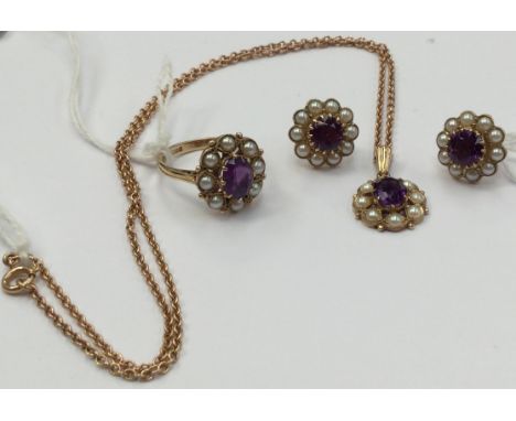 A suit of amethyst seed pearl 9ct gold jewellery, comprising a ring set with an oval amethyst to the centre with pearl surrou