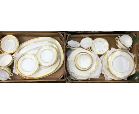 A Minton part dinner service, each piece decorated with gold edges, No 'M3212' to base, comprising two meat plates, ten dinne