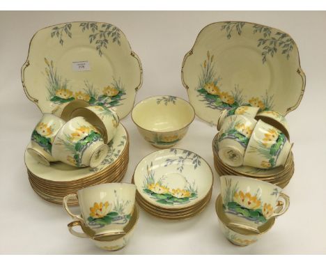 An Art Deco Crown Staffordshire tea set for 12, including 12 cups, 12 saucers, plates, tea plates and sugar bowl