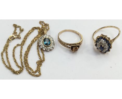 A collection of 9ct and 10ct gold jewellery to include a blue topaz and diamond pendant, set to the centre with an oval blue 