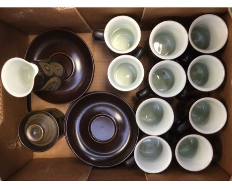 A Denby 'Arabesque' coffee set comprising ten cups, eleven saucers, milk jug and sugar bowl