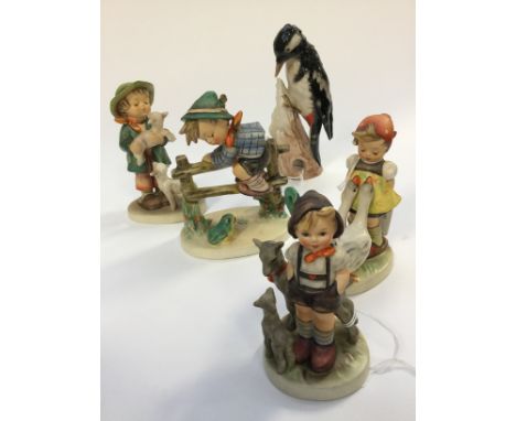 A large Hummel (Goebel) shepherd boy figure and a similar sized Hummel figure group 'Retreat to Safety' and two smaller figur