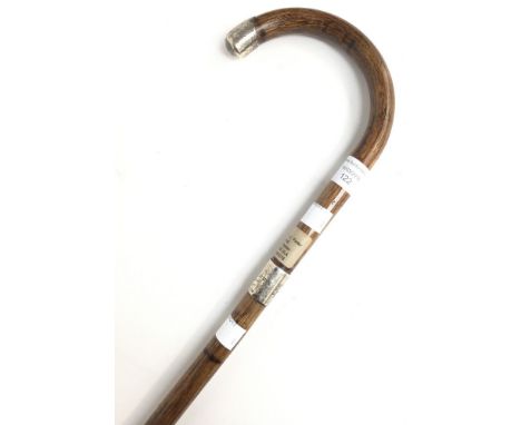 A hallmarked silver mounted walking stick. 