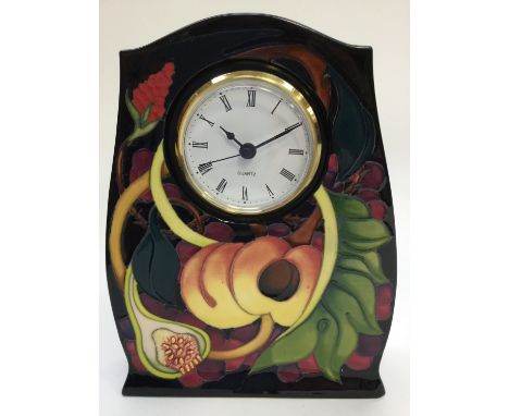 A Moorcroft 'Queens Choice' mantle clock, designed by Emma Bossons, dated 2000 to base 