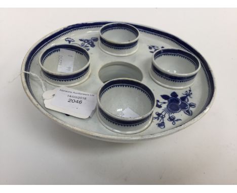 A Spode pearlware egg cruet, with four egg cups, blue and white transfer printed Condition : two cups restored to feet