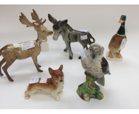 A Beswick model of a Stag; together with similar of a bird and a duck plus a ceramic model of a Donkey and similar of a Corgi