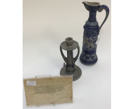 A German salt glazed stoneware Art Nouveau candlestick and a similar ewer (2) 