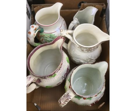 An early 19th Century Staffordshire jug, possibly Prattware; together with an early 19th Century Sunderland jug, another, pos