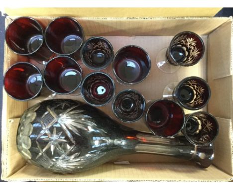 A Ruby flash cut decanter set, comprising decanter and six Port glasses, plus a further set of six plain glasses (13) 