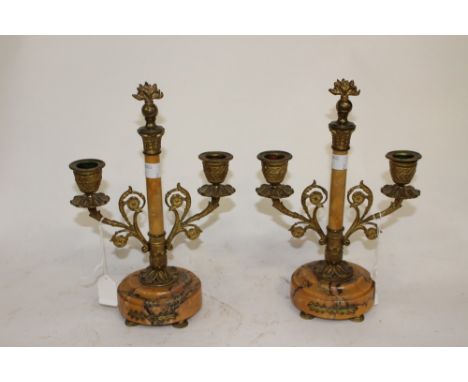 A pair of 19th Century French ormolu and Sienna marble three light candelabra/garniture 