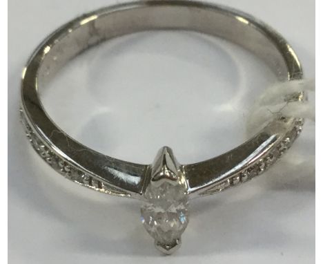 A marquise diamond solitaire, claw set with grain set diamond shoulders, 18ct white gold, size K, total gross weight 2.6 gram