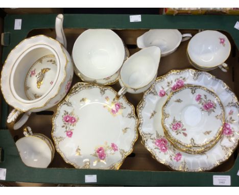 A Royal Crown Derby 'Royal Pinxton Roses' teaset, comprising teapot, four cups, saucers and side plates, cake plates, milk ju