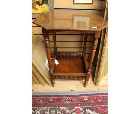 A Victorian aesthetic oak two-tier octagonal topped occasional table, base tier with a gallery edge