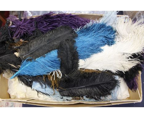 A collection of Ostrich feathers in various sizes and shades of grey, blue, pale blue, brown, cream, black, mauve, circa 1910