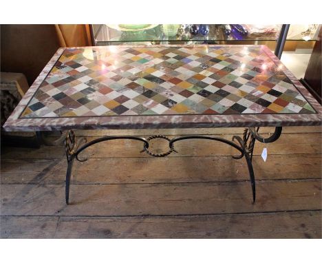 A marble specimen table raised on wrought iron stand, approx 52cms high x 94cms long x 58cms wide 