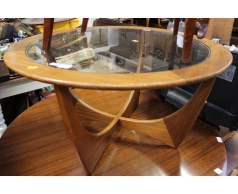 A 1970s teak circular glass topped coffee table