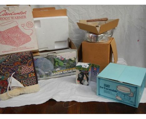 A mixed lot of  boxed items including new footwarmer, new kettle. diving head light, garden speakers etc.,