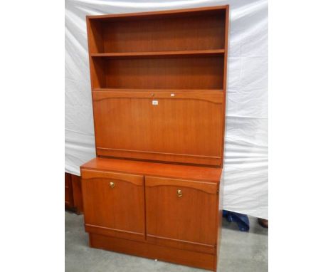 A teak 3 door bedroom unit with lockable mirrored shelf with light, H 175 cm, W 100 cm, D 45 cm.